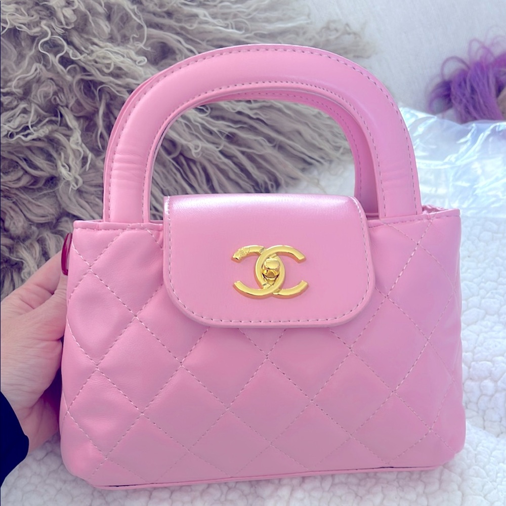 Chanel pink quilted purse. New. As Is. Has a matching strap.